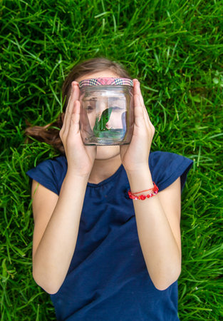 Child in nature with a lizard. selective focus. kid.の写真素材