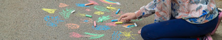 Children draw with chalk on the pavement. selective focus. kid.の写真素材