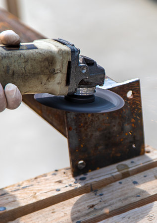 A man processes a metal pole. selective focus. nature.の写真素材