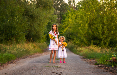 A child in a field of sunflowers Ukraine. selective focus. Nature.の写真素材