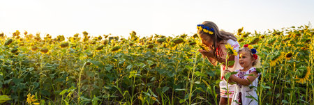 A child in a field of sunflowers Ukraine. selective focus. Nature.の写真素材
