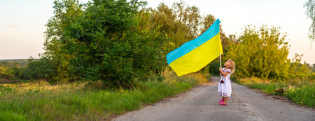 Child with the flag of Ukraine. selective focus. Nature.の写真素材