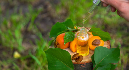 Apricot kernel oil in a bottle. Selective focus. Food.の写真素材