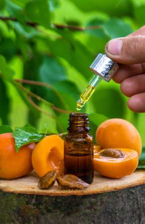 Apricot kernel oil in a bottle. Selective focus. Food.の写真素材