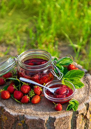Strawberry jam in the garden. Selective focus.の写真素材