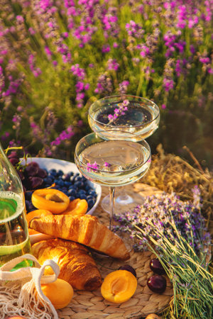 Picnic with wine in a lavender field. Selective focus. Nature.の写真素材