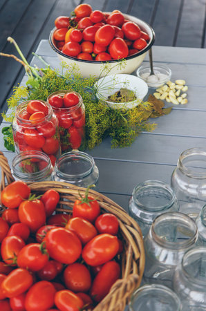 Preserving tomatoes in jars. Selective focus. Food.の写真素材