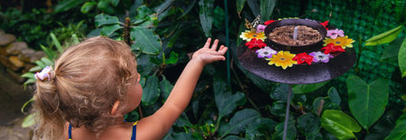 A child holds a beautiful butterfly. Selective focus. Nature.の写真素材
