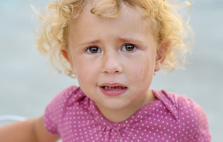 A child is crying on the street. Selective focus. kid.
