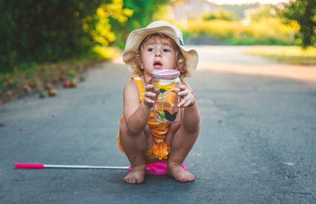 A child catches a butterfly in nature. selective focus. kid.