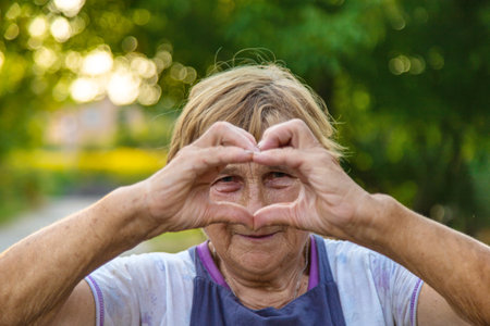 Elderly woman portrait in the garden. selective focus. Nature.の写真素材