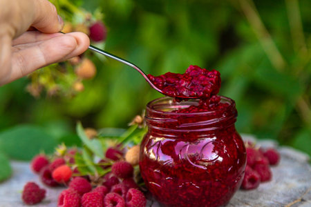 Raspberry jam in the garden. Selective focus.の写真素材