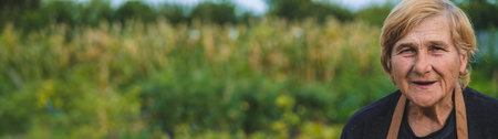 Elderly woman portrait in the garden. selective focus.の写真素材