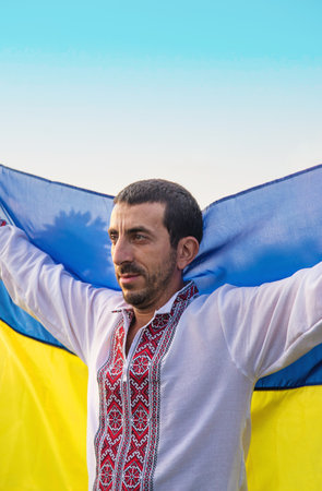 Man wearing an embroidered shirt. Selective focus.の写真素材