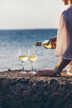 Glasses of wine on the seashore. Selective focus.