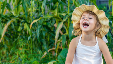 Portrait of a child in a garden. Selective focus.の写真素材
