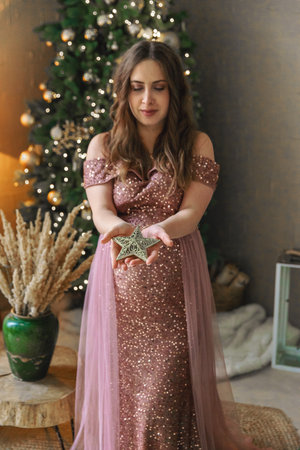 Pregnant woman on Christmas background. Selective focus.の写真素材