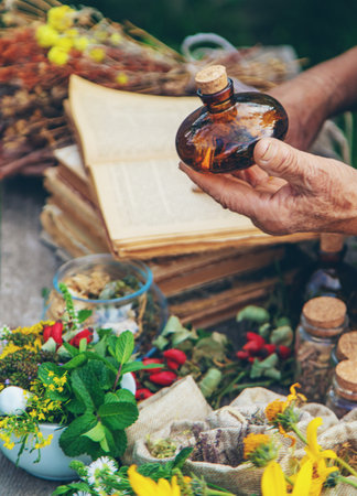 Medicinal herbs alternative medicine old woman. Selective focus.の写真素材