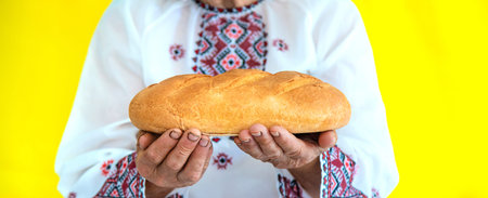 Grandmother is a Ukrainian patriot in an embroidered shirt. selective focus.の写真素材