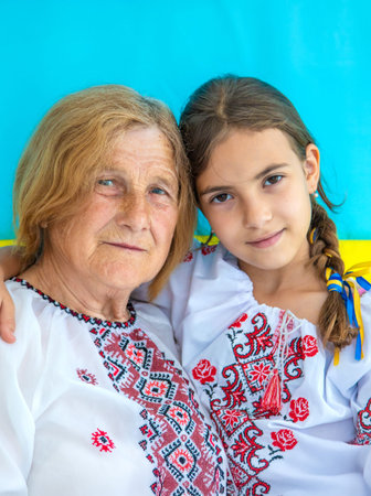 Ukrainian grandmother and granddaughter in vyshyvanka. selective focus.の写真素材