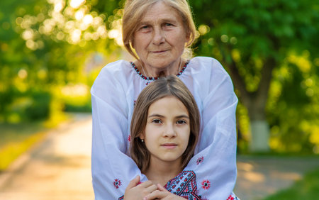 Ukrainian grandmother and granddaughter in vyshyvanka. selective focus.の写真素材