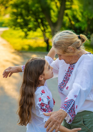 Ukrainian grandmother and granddaughter in vyshyvanka. selective focus.の写真素材