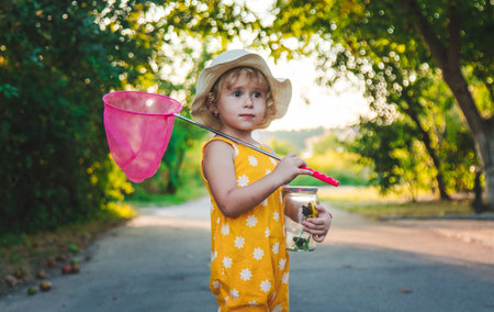 A child catches a butterfly in nature. selective focus.の写真素材