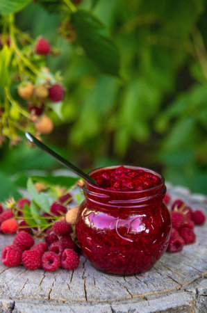 Raspberry jam in the garden. Selective focus.の写真素材