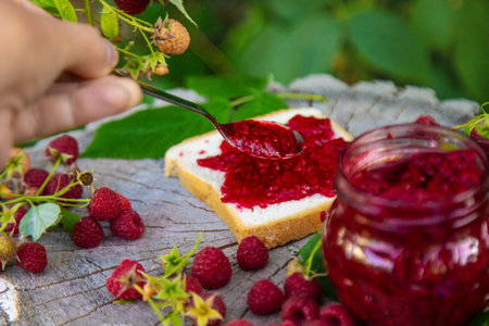 Raspberry jam in the garden. Selective focus.の写真素材