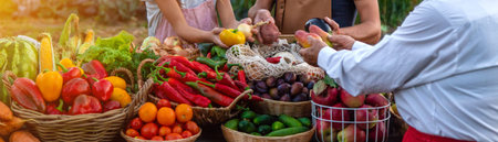 Father and daughter sell vegetables and fruits at the farmers market. Selective focus.の写真素材