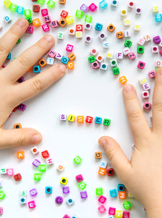 Child cubes and the word sister. Selective focus.の写真素材