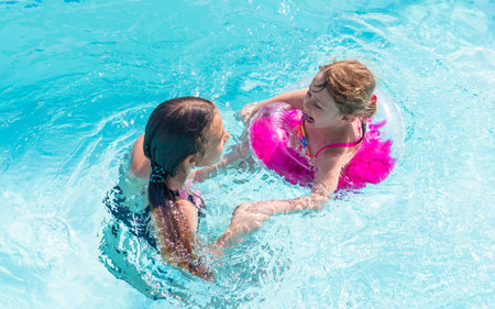 Children girls swimming in the pool. selective focus.