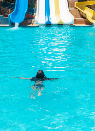 kid girl swimming in pool. selective focus.の写真素材