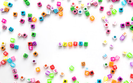 Child cubes and the word sister. Selective focus.
