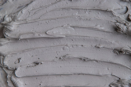 Clay texture spa mask for face and body. Selective focus.