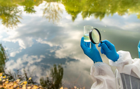 Take water samples for analysis. Selective focus.