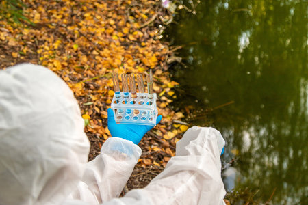 Take water samples for analysis. Selective focus.