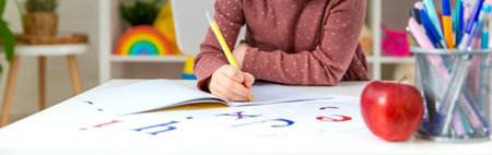 A child doing homework at home. Selective focus.