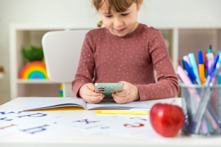 A child doing homework at home. Selective focus.