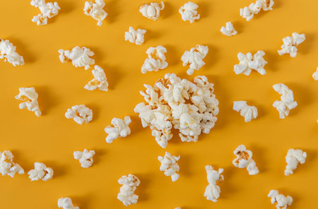 There a lot of popcorn on the table at home. Selective focus.