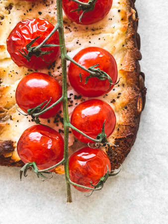 Tasty rye toast with grilled tomatoes and cheeseの写真素材