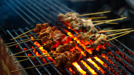 chicken and beef satay on the grillの写真素材