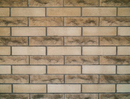 Light brown beige old brick wall background texture. Photoの写真素材