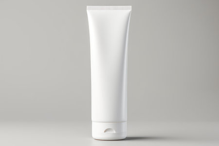 Mockup of tube for toothpaste, cream, gel, cosmetic sample. Clean mockup of cosmetic products. White plastic tube isolated on white background. Template for design, advertising. Close up Copy spaceの素材