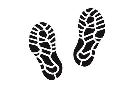 Human shoe footprints. Pair of prints from sneakers or boots. Left and right leg. Shoe sole. Walking foot steps. Black and white vector isolated on white. Icon, symbol, pictogram. kids footprintsのイラスト素材