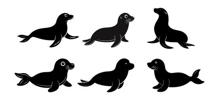 Black silhouettes of sea lions isolated on a white background. Concept of marine animals, cute cartoon seals, wildlife illustration. Print, icon, design elements.のイラスト素材