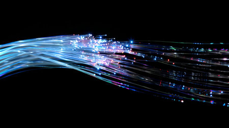 Minimalistic view of intertwined fiber optic cables illuminated on black background. concept of...