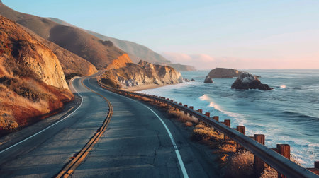 Scenic Coastal Road Winding Alongside the Ocean. Concept of Nature Travel, Serenity, Adventure, Highway, and Stunning Landscapes.の写真素材