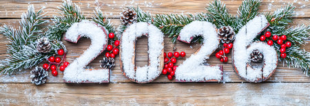 Snow-Covered 2026 with Festive Pine Cones and Berries Arrangement on Wooden Background. Concept of...