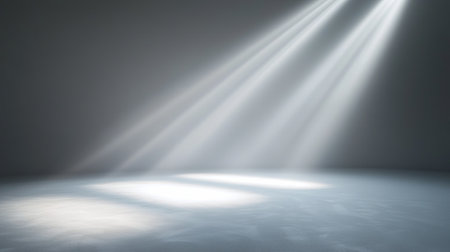 Spotlight Beam Illuminating an Empty Modern Stage in Minimalist Setting. Concept of Theater Lighting, Dramatic Atmosphere, Creative Performances, Artistic Expression. Copy space.の写真素材